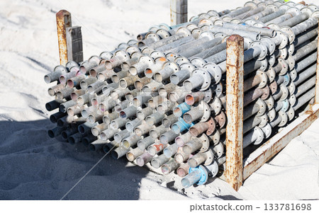 Reinforcement rusty construction. Rusty armature on construction site. Reinforcement on building site. Industry construction. Reinforcing cage. Industrial background. Steel rebar for concrete pouring 133781698