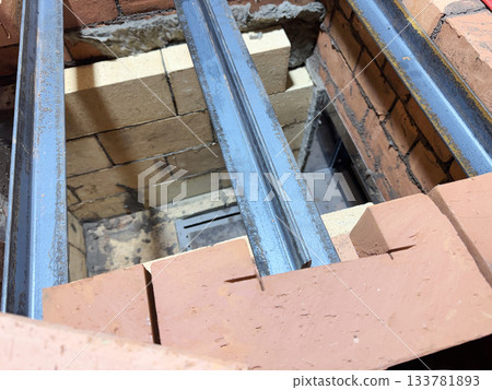 Installation of the heating stove ceiling with bricks on metal angles. Construction of a heating stove. Installation of the heating stove ceiling with bricks on metal angles. Construction of a heating stove. 133781893