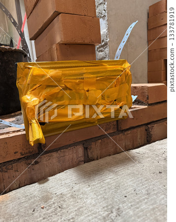 Construction of a heating stove. The ash pan door is fixed. Brickwork of the stove. Construction of a heating stove. The ash pan door is fixed. Brickwork of the stove. 133781919