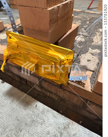 Construction of a heating stove. The ash pan door is fixed. Brickwork of the stove. 133781920