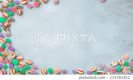 photo styling in a form of a candy frame border on a white background with copy space for text, colorful pastel birthday party decorations in a flat lay style, isolated on a light grey background. photo styling in a form of a candy frame border on a white background with copy space for text, colorful pastel birthday party decorations in a flat lay style, isolated on a light grey background. 133781952