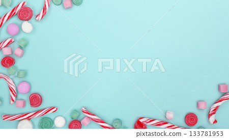 photo styling in a form of a candy frame border on a white background with copy space for text, colorful pastel birthday party decorations in a flat lay style, isolated on a light grey background 133781953