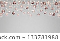 festive string lights hanging from the ceiling, casting a soft glow on clear glass marbles in shades of rose gold and white against an isolated gray background 133781988