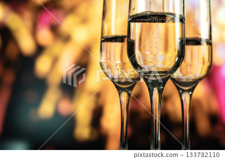 Two glasses of champagne against a backdrop of fireworks 133782110