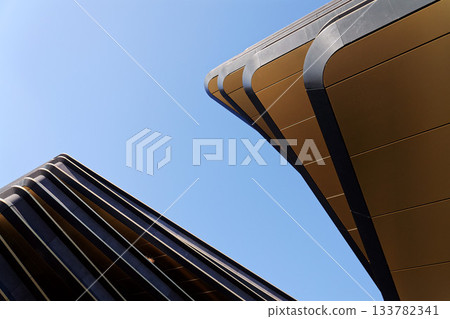 Masarycka MSD Masaryk Station Development office and retail building by Zaha Hadid Architects with golden facade on November 19, 2025 in Prague, Czech Republic. Masarycka MSD Masaryk Station Development office and retail building by Zaha Hadid Architects with golden facade on November 19, 2025 in Prague, Czech Republic. 133782341