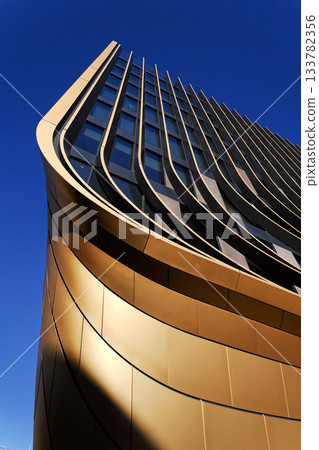 Masarycka MSD Masaryk Station Development office and retail building by Zaha Hadid Architects with golden facade on November 19, 2025 in Prague, Czech Republic. Masarycka MSD Masaryk Station Development office and retail building by Zaha Hadid Architects with golden facade on November 19, 2025 in Prague, Czech Republic. 133782356