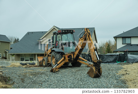 Milton WA USA, Nov 29, 2025 - A working excavator at a house construction site Milton WA USA, Nov 29, 2025 - A working excavator at a house construction site 133782903