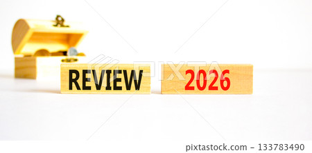 Review 2026 symbol. Concept words Review 2026 on beautiful wooden blocks. Beautiful white paper background. Beautiful wooden chest with coins. Business and review 2026 concept. Copy space. Review 2026 symbol. Concept words Review 2026 on beautiful wooden blocks. Beautiful white paper background. Beautiful wooden chest with coins. Business and review 2026 concept. Copy space. 133783490