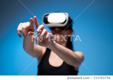 VR designer using hand gestures to manipulate virtual interface while crafting digital creative concepts VR designer using hand gestures to manipulate virtual interface while crafting digital creative concepts 133783756