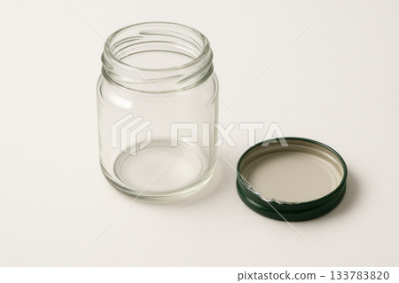 Empty glass jar with lid open. Space for text. Empty glass jar with lid open. Space for text. 133783820
