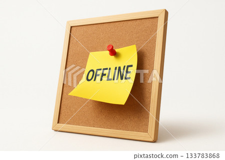 Cork board with an offline note on a bright sticker. Cork board with an offline note on a bright sticker. 133783868