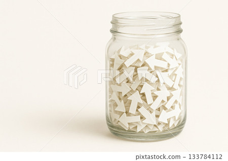 A glass jar full of white upward arrows, symbolizing growth. Space for text. A glass jar full of white upward arrows, symbolizing growth. Space for text. 133784112