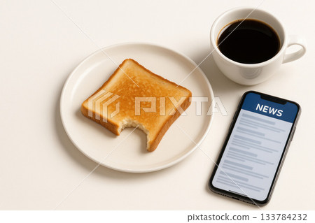 Breakfast with toast, coffee and smartphone with news. Breakfast with toast, coffee and smartphone with news. 133784232