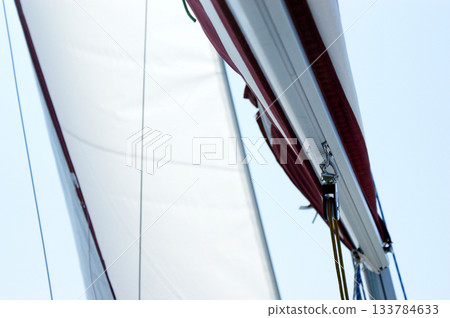 sail from a sailboat on a lake against the sky sail from a sailboat on a lake against the sky 133784633