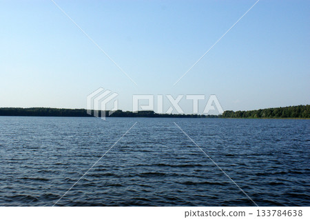 forest on the lake on the lake far away on the horizon forest on the lake on the lake far away on the horizon 133784638