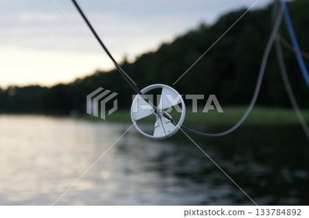 element of rope yacht equipment against the backdrop of the setting sun element of rope yacht equipment against the backdrop of the setting sun 133784892