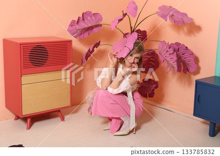 Fashion enthusiast in colorful vintage setting with creative styling 133785832