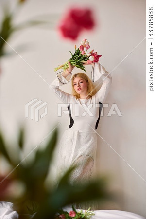 white woman wearing tulip crown, joyful home celebration 133785838