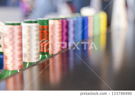 Colorful spools of industrial sewing thread Colorful spools of industrial sewing thread 133786990