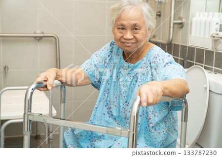 Asian elderly woman patient use walker and toilet bathroom handle security in nursing hospital, healthy strong medical. Asian elderly woman patient use walker and toilet bathroom handle security in nursing hospital, healthy strong medical. 133787230