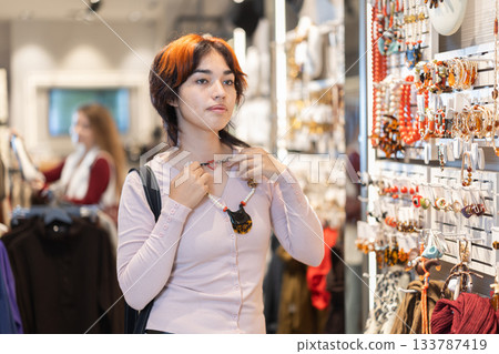 Young Asian woman chooses stylish jewelry 133787419