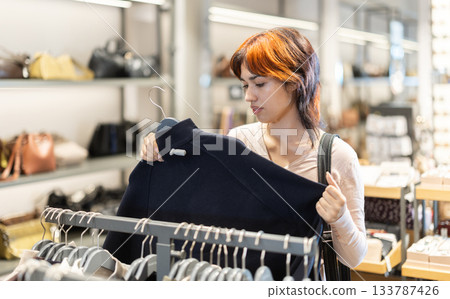 Young woman search and choose jacket Young woman search and choose jacket 133787426