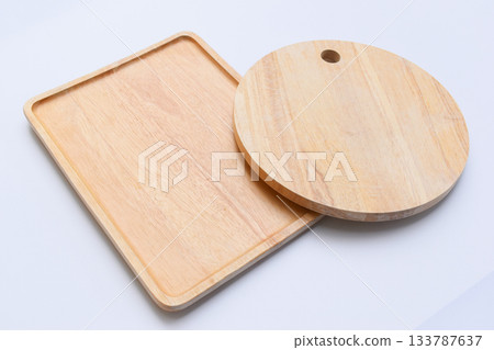 brown wooden tray and sphere cuttingboard isolated on white background 133787637