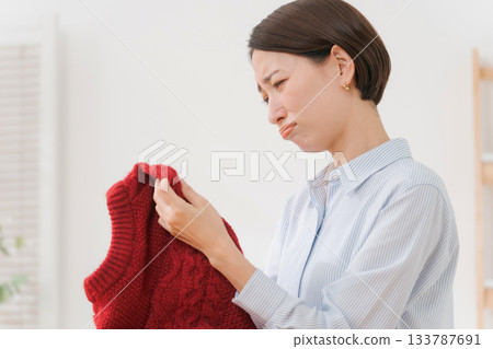 Woman confused by sweater 133787691