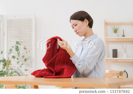Woman confused by sweater 133787692