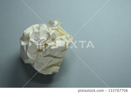 round lump paper on grey background, recycle used paper 133787706