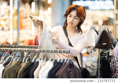 Young woman search and choose jacket Young woman search and choose jacket 133787713