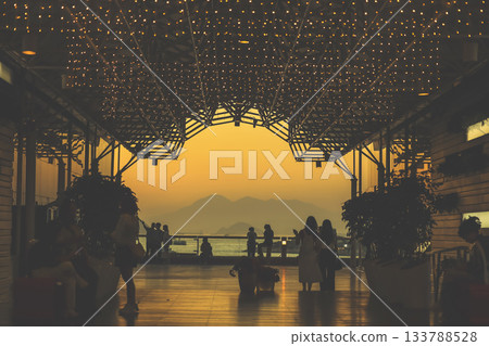 Nov 16 2025 Elegant Atrium Interior Featuring Sunset and Architectural Silhouettes 133788528