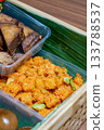 Indonesian Kentang Balado Spicy Potato Dish with Chili Paste and Petai Beans in Traditional Woven Catering Box 133788537