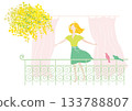 A woman enjoying the spring breeze on a balcony 133788807