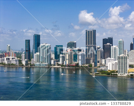 Aerial view of Brickell skyscrapers. Modern cityscape of downtown Miami. Panoramic Miami skyline above the coastline. Brickell Key aerial view in Miami. Aerial view of Brickell skyscrapers. Modern cityscape of downtown Miami. Panoramic Miami skyline above the coastline. Brickell Key aerial view in Miami. 133788829