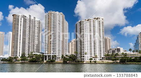 Aerial view of Brickell skyline in downtown Miami. Modern skyscrapers rise above Biscayne Bay. Miami Urban landscape with iconic buildings. Miami cityscape. Aerial view of Brickell skyline in downtown Miami. Modern skyscrapers rise above Biscayne Bay. Miami Urban landscape with iconic buildings. Miami cityscape. 133788843