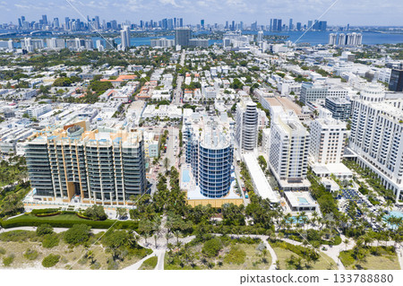 Miami beach with turquoise waters. Aerial view of sandy coastline and waves. Tropical Miami Beach scene with sandy beach. Oceanfront of South Miami. Miami beach with turquoise waters. Aerial view of sandy coastline and waves. Tropical Miami Beach scene with sandy beach. Oceanfront of South Miami. 133788880