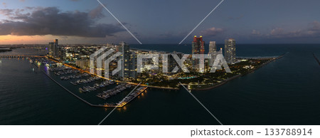 Aerial panoramic view of Miami skyline. Panoramic cityscape of Miami with coastal skyscrapers. Panoramic view of Miami Beach from above. Iconic landmarks line of Miami coastline. Miamis famous Aerial panoramic view of Miami skyline. Panoramic cityscape of Miami with coastal skyscrapers. Panoramic view of Miami Beach from above. Iconic landmarks line of Miami coastline. Miamis famous 133788914