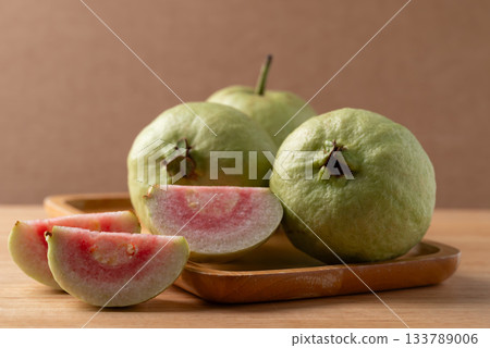 Red guava on wooden background, Tropical fruit high vitamin C 133789006
