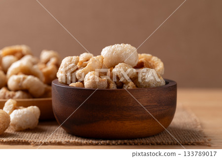 Pork rind in a wooden bowl, Northern Thai food Pork rind in a wooden bowl, Northern Thai food 133789017