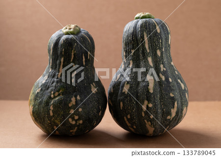Green butternut squash pumpkin on brown background 133789045
