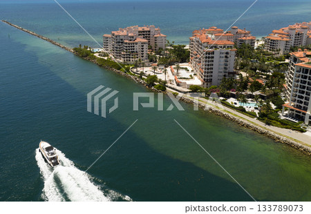 Yacht cruising near Miami Beach. Aerial view of boats on turquoise waters in Miami. Yacht retreat in South Florida Miami. Yacht cruising near Miami Beach. Aerial view of boats on turquoise waters in Miami. Yacht retreat in South Florida Miami. 133789073