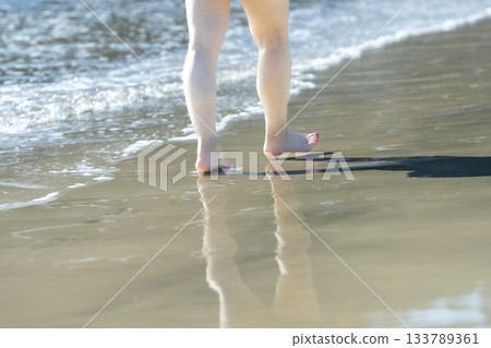 Woman walking on the beach, walking, sunset, summer day, new days, beach, island, travel, trip 133789361