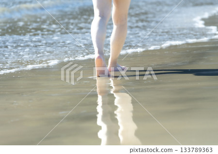 Woman walking on the beach, walking, sunset, summer day, new days, beach, island, travel, trip 133789363