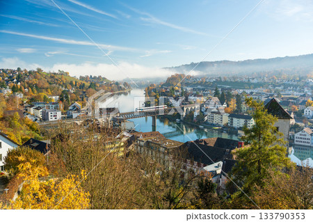 A train crossing the Feuertalenrhein railway bridge in autumn, Schaffhausen, Switzerland A train crossing the Feuertalenrhein railway bridge in autumn, Schaffhausen, Switzerland 133790353
