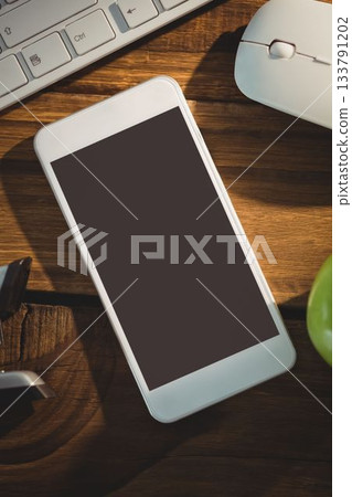 Flat design is featuring smartphone on wooden desk with keyboard, mouse, green apple, lens cap Flat design is featuring smartphone on wooden desk with keyboard, mouse, green apple, lens cap 133791202