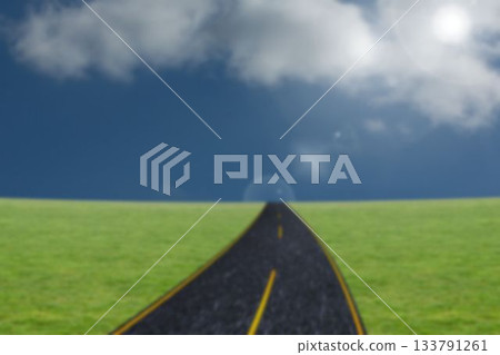 Road by grass field against sky 133791261