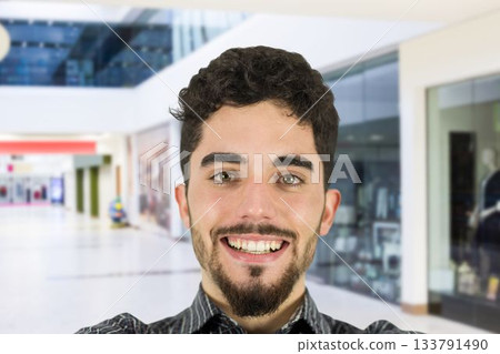 Portrait of smiling man at mall Portrait of smiling man at mall 133791490