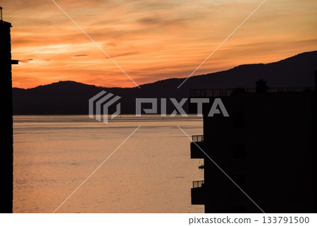 Scenic view of lake mountain during sunset 133791500