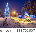 A decorated Christmas tree in a snowy town 133791607